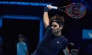 Six-time ATP World Tour Finals champion Roger Federer fended off Kei Nishikori in three sets to steam through to SaturdayÈs semi-finals with an u...