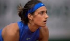 Caroline Garcia maintained her hopes of qualifying for the WTA Finals in Singapore by producing a stirring fight back to shock Elina Svitolina at t...