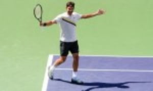 Roger Federer displayed his battling qualities as he recovered from a precarious position to defeat Borna Coric 5-7 6-4 6-4 and reach an eighth fin...