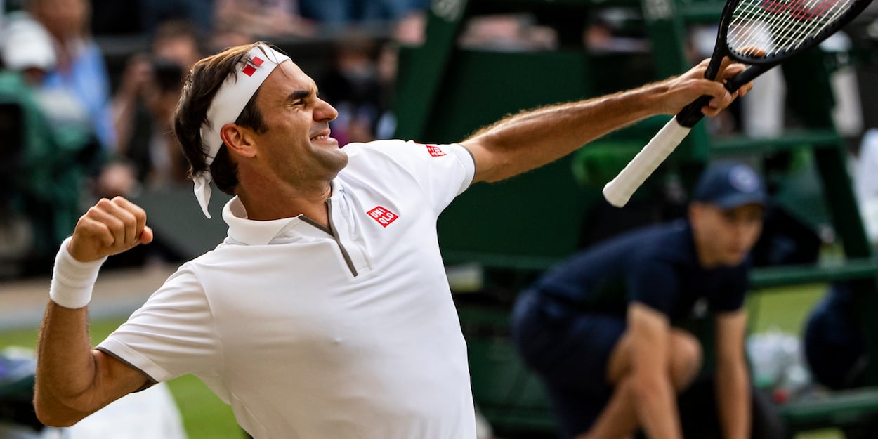 Roger Federer punches the air at Wimbledon