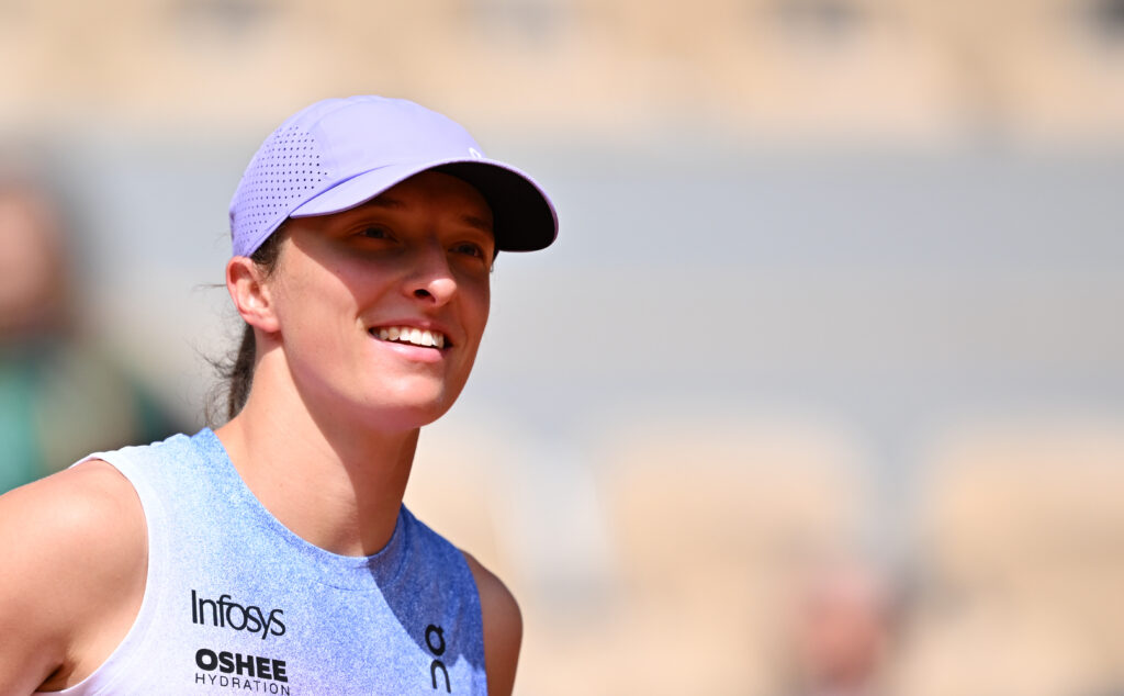 Iga Swiatek of Poland plays against Rebecca Sramkova of Slovakia in the Women's Singles First Round match on Day Two of the 2025 French Open at Roland Garros Stadium.
