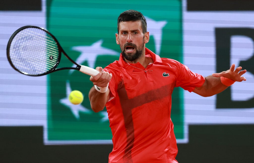 Novak Djokovic of Serbia plays a forehand against Mackenzie McDonald of United States during the Men's Singles First Round match during Day Three of the 2025 French Open at Roland Garros.
