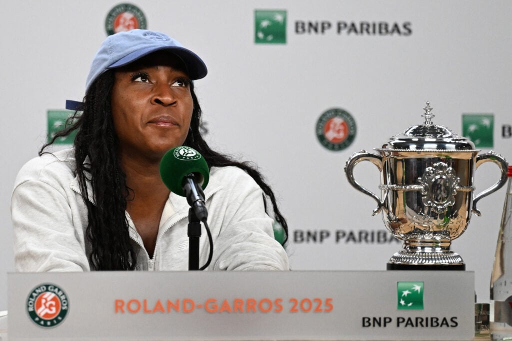 US Coco Gauff gives a press conference past her trophy after her victory over Belarus' Aryna Sabalenka in their women's singles final match on day 14 of the French Open tennis tournament.
