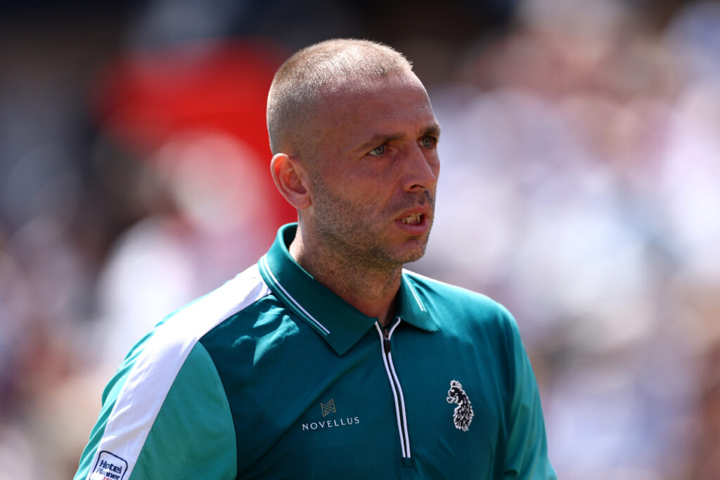 Daniel Evans of Great Britain looks on against Frances Tiafoe of United States during the Men's Singles First Round match on Day Eight of the 2025 HSBC Championships at The Queen's Club on June 16, 2025 in London, England.