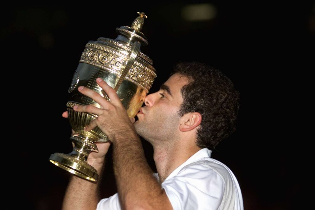 US Pete Sampras kisses the Gentlemen's Singles tro