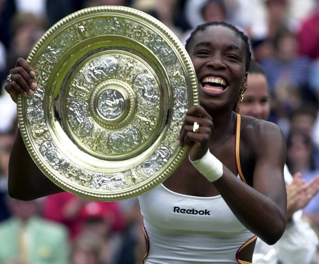 Venus Williams of the USA with the Wimbledon trophy after beating Lindsay Davenport of the USA during the final of the womens singles in the Wimbledon Lawn Tennis Championship at the All England Lawn Tennis and Croquet Club, Wimbledon, London.