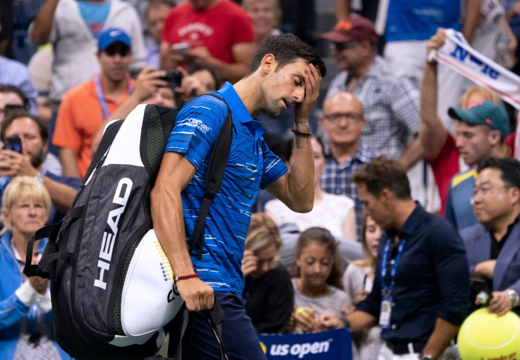 Novak Djokovic facepalms as he retires injury from the US Open