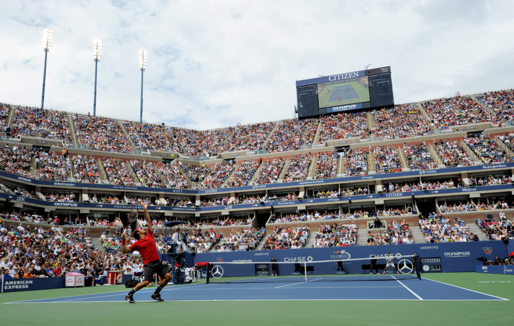Roger Federer serves to Novak Djokovic at the US Open