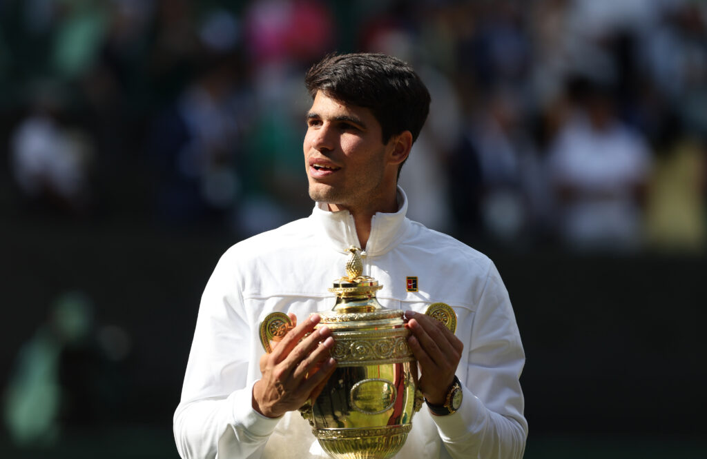 Carlos Alcaraz holds the Wimbledon trophy