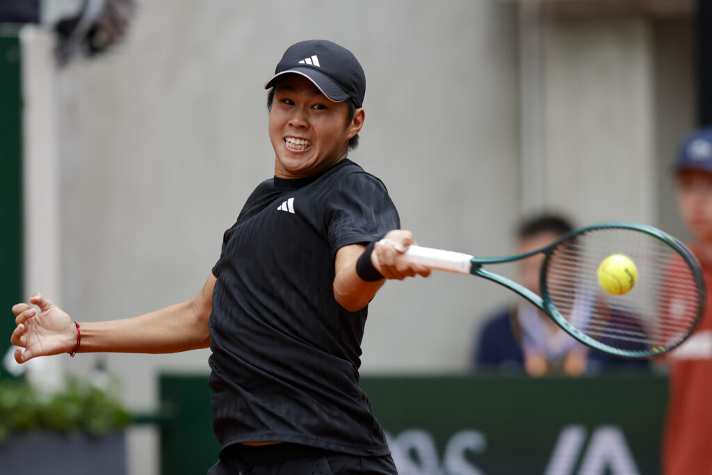Learner Tien hits a forehand
