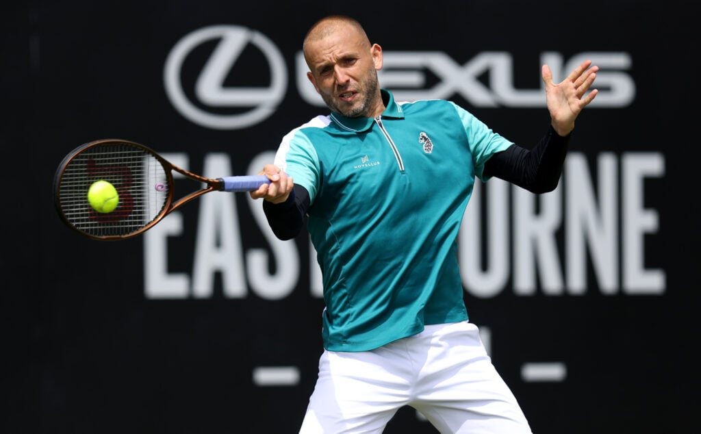 Dan Evans of Great Britain plays a forehand against Jenson Brooksby of United States during the Men's Singles Quarter Final match on Day Four of the Lexus Eastbourne Open at Devonshire Park on June 26, 2025 in Eastbourne, England.