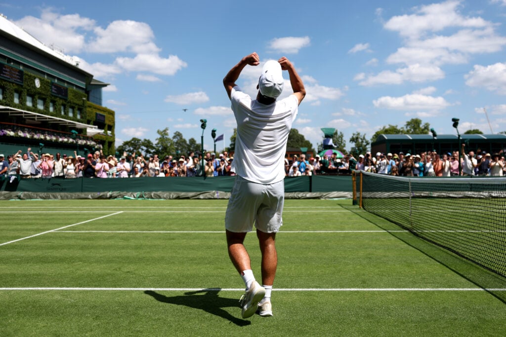 Oliver Tarvet lifts his arms in celebration