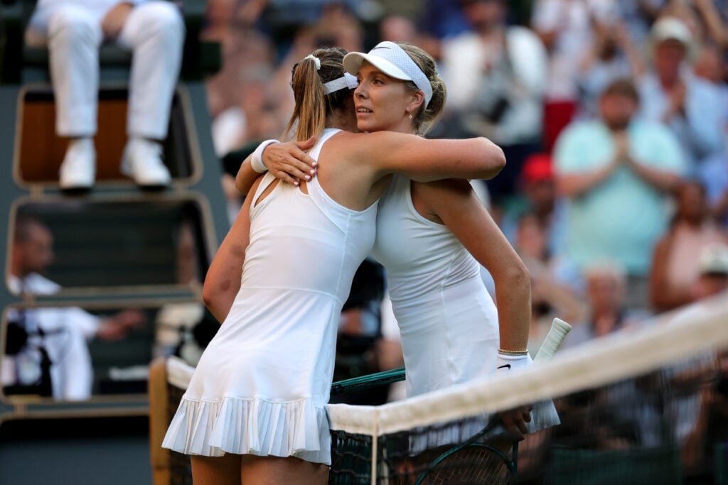 Katie Boulter and Paula Badosa hug at the net
