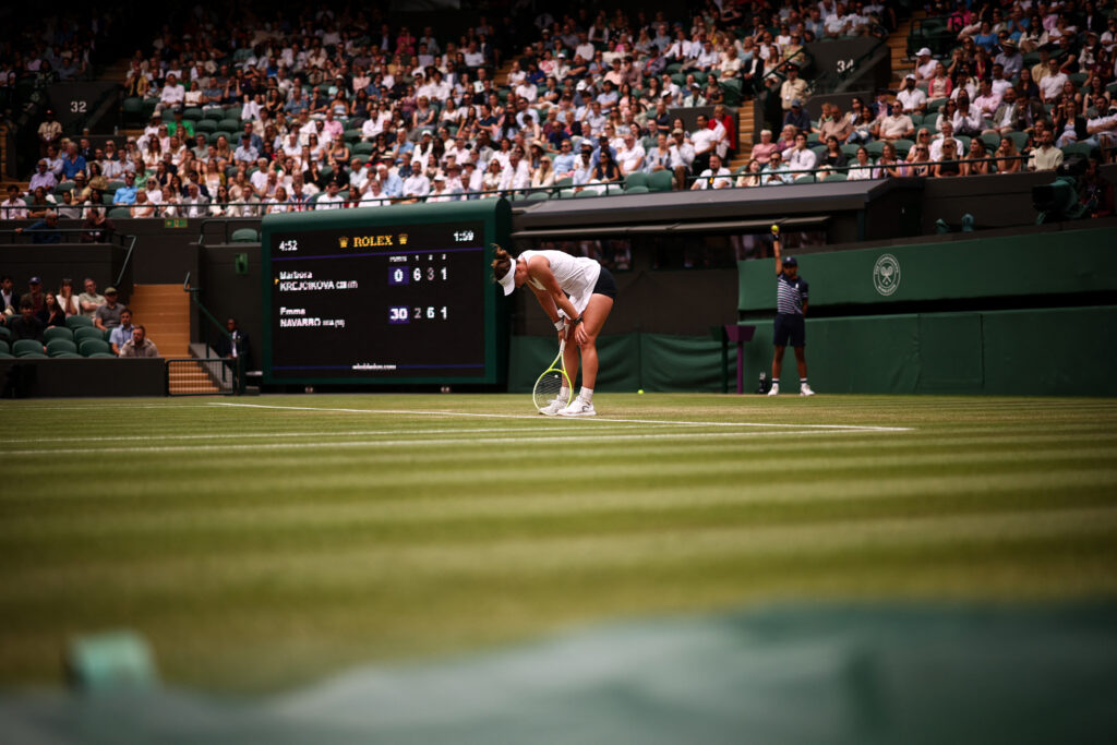 Barbora Krejcikova hunches over in pain