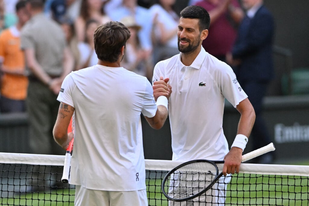 Novak Djokovic and Flavio Cobolli shake hands