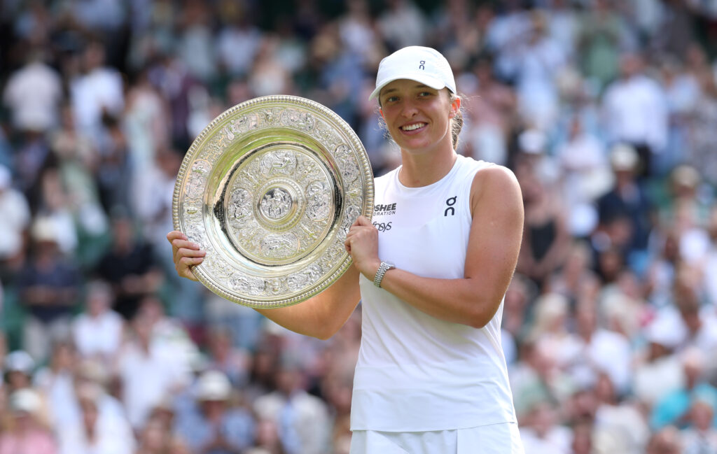 Iga Swiatek of Poland poses with the Ladies’ Singles Trophy following her victory against Amanda Anisimova of United States during the Ladies' Singles Final on day thirteen of The Championships Wimbledon 2025 at All England Lawn Tennis and Croquet Club on July 12, 2025 in London, England.