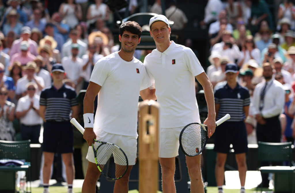 Carlos Alcaraz of Spain and Jannik Sinner of Italy pose for a photo at the net prior to the Gentleman's Singles Final on day fourteen of The Championships Wimbledon 2025 at All England Lawn Tennis and Croquet Club on July 13, 2025 in London, England.
