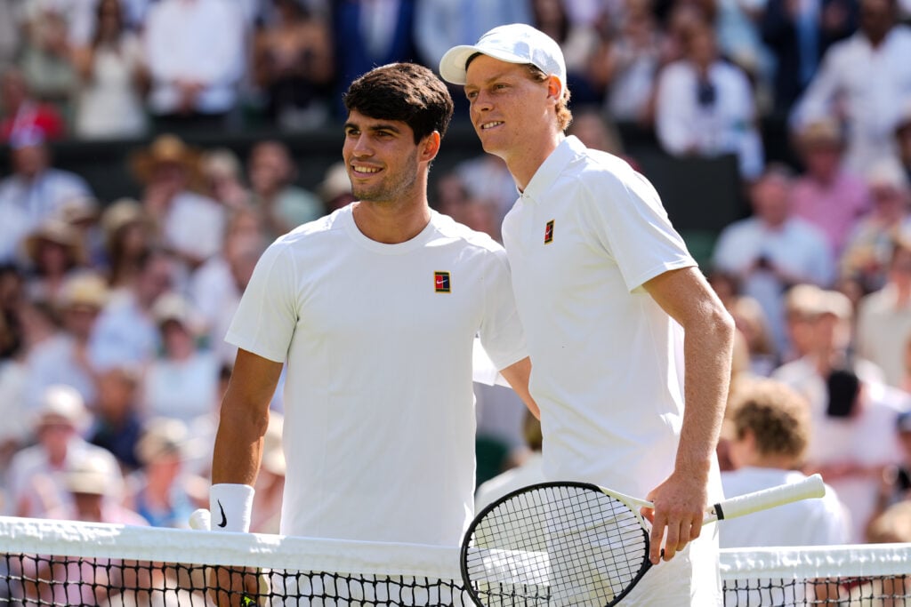 Jannik Sinner (R) of Italy and Carlos Alcaraz of Spain pose for a photo before their Gentlemen's Singles Final match on day fourteen of The Championships Wimbledon 2025 at All England Lawn Tennis and Croquet Club on July 13, 2025 in London, England.