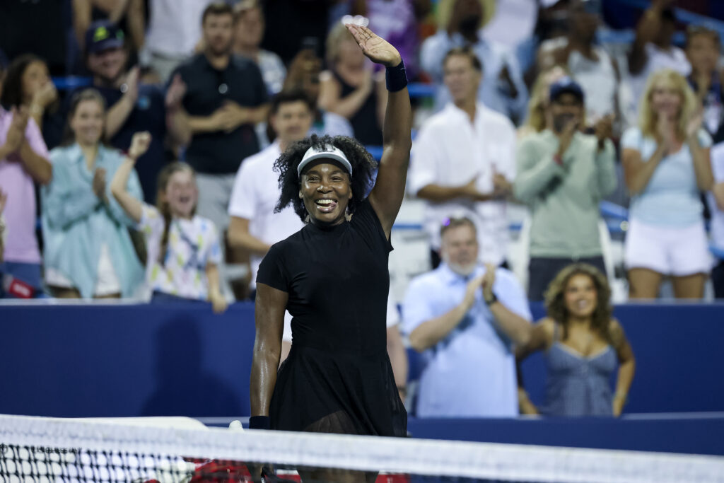Venus Williams celebrates after winning a women's single match against Peyton Stearns.