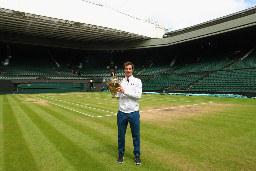 Andy Murray poses with the Wimbledon trophy