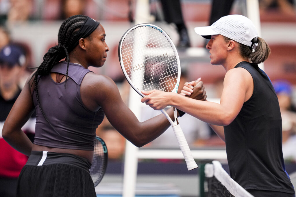 Coco Gauff of the United States shakes hands with Iga Swiatek of Poland during the Women's Singles semifinal match during day 12 of the 2023 China Open at National Tennis Center on October 7, 2023 in Beijing, China.
