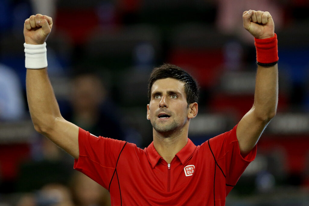 Novak Djokovic of Serbia celebrates his win over Fabio Fognini of Italy during the Shanghai Rolex Masters at the Qi Zhong Tennis Center on October 10, 2013 in Shanghai, China.