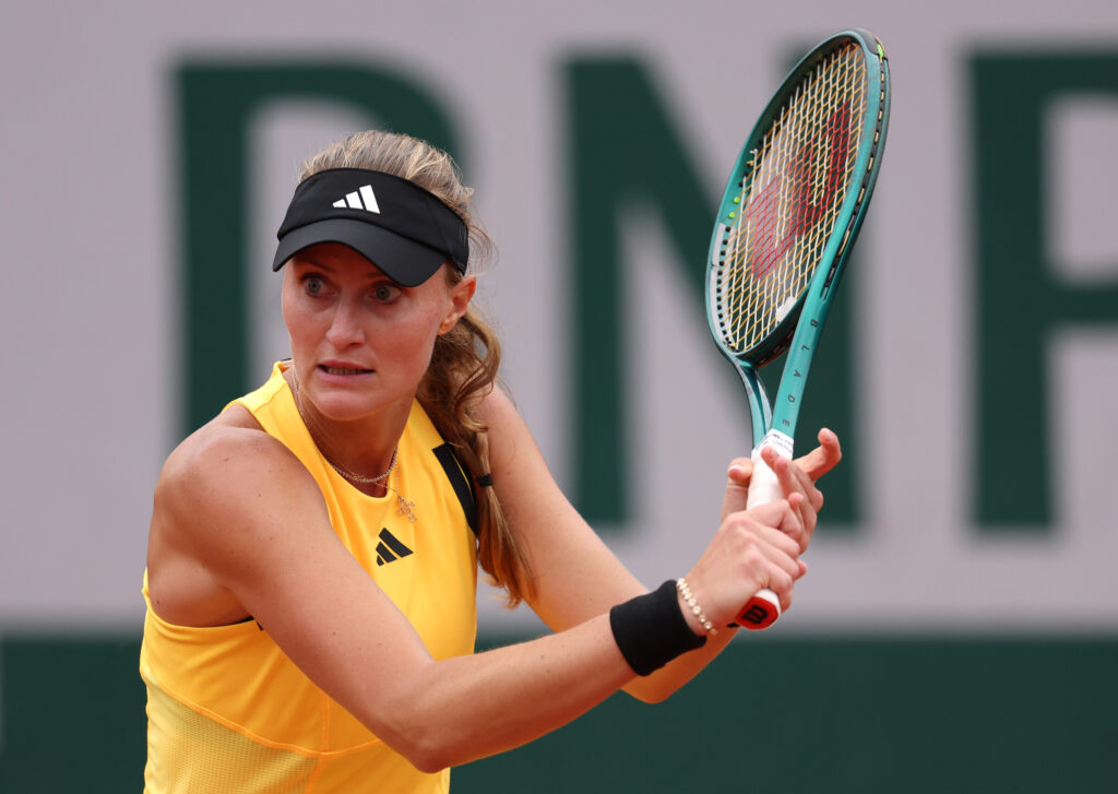 Kristina Mladenovic of France plays a backhand against Petra Martic of Croatia in the Women's Singles first round match on Day Three of the 2024 French Open at Roland Garros on May 28, 2024 in Paris, France.