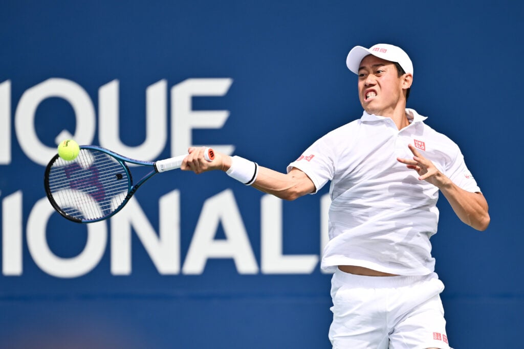 Kei Nishikori of Japan plays a forehand against Stefanos Tsitsipas of Greece in the Men's Singles second round match during Day Three of the ATP Masters 1000 National Bank Open at Stade IGA on August 8, 2024 in Montreal, Canada.