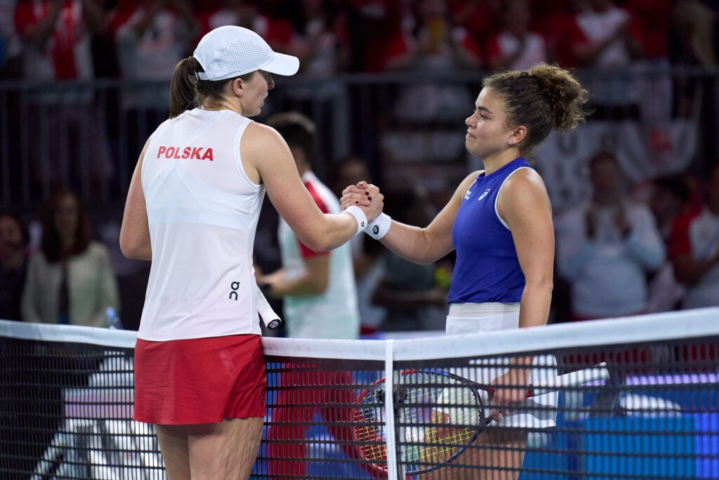 Iga Swiatek of Team Poland greets Jasmine Paolini of Team Italy following their singles match in the Semi-Final tie between Poland and Italy during the Billie Jean King Cup Finals at Palacio de Deportes Jose Maria Martin Carpena on November 18, 2024 in Malaga, Spain.