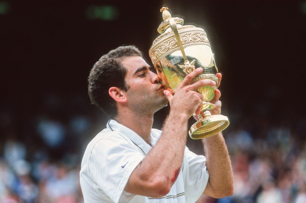 Pete Sampras of the USA kisses the trophy after defeating Andre Agassi of the of USA in the Men's Singles Final at The Wimbledon Lawn Tennis Championship at the All England Lawn and Tennis Club at Wimbledon on July 4th, 1999 in London, England.