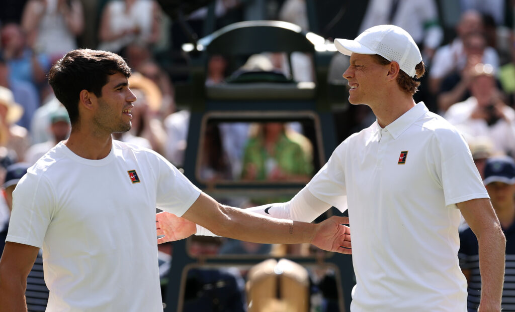 Jannik Sinner of Italy and Carlos Alcaraz of Spain together at the net before the Gentleman's Singles Final on day fourteen of The Championships Wimbledon 2025 at All England Lawn Tennis and Croquet Club on July 13, 2025 in London, England.