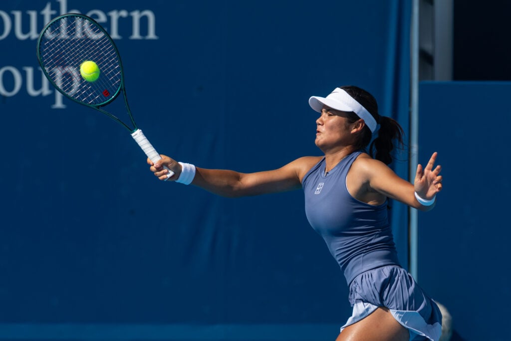Emma Raducanu hits a high forehand