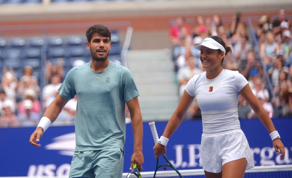 Carlos Alcaraz and Emma Raducanu smile on court during the US Open 2025 - Mixed Doubles