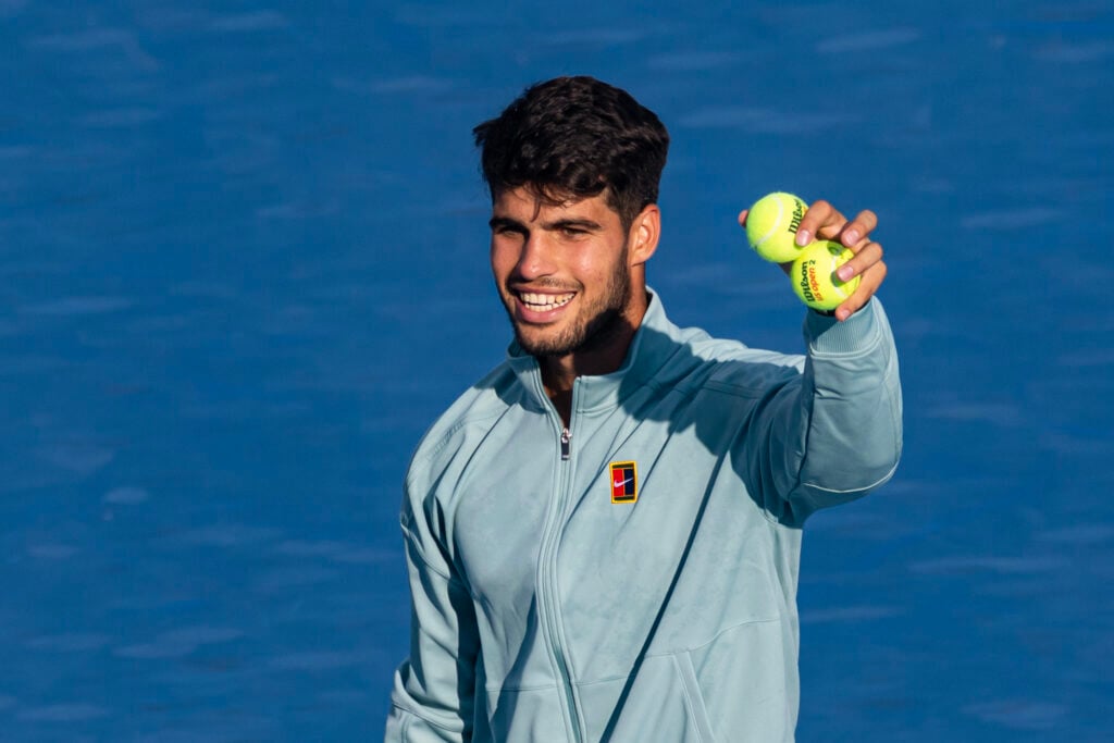 Carlos Alcaraz smiles