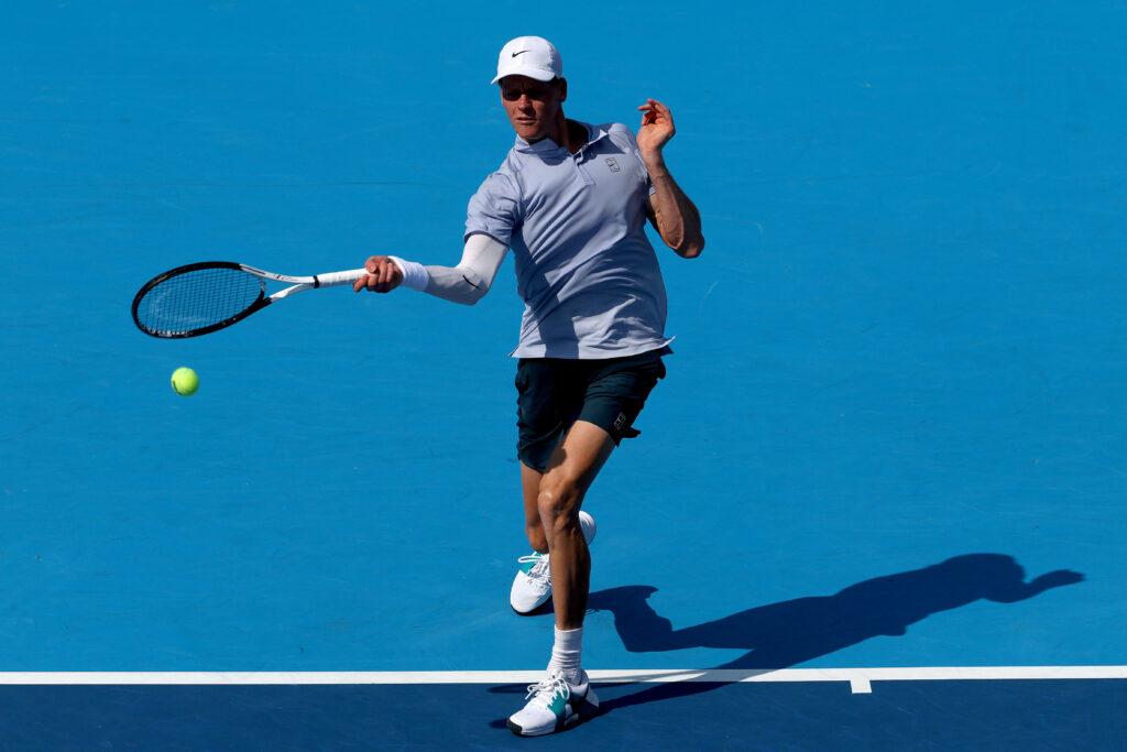 Jannik Sinner hits a forehand