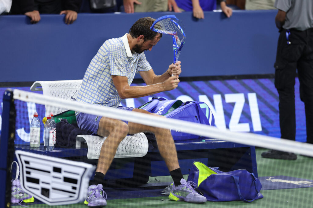 Russia's Daniil Medvedev breaks his racket after losing his men's singles first round tennis match against France's Benjamin Bonzi on day one of the US Open tennis tournament at the USTA Billie Jean King National Tennis Center in New York City, on August 24, 2025.