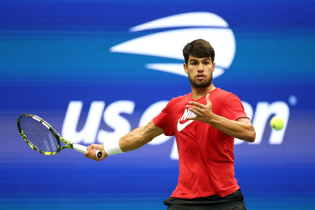Carlos Alcaraz prepares to hit a forehand