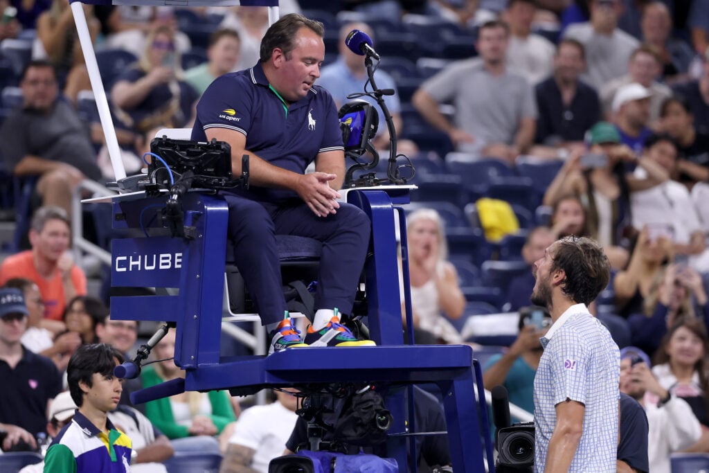 Daniil Medvedev (R) argues with chair umpire Greg Allensworth (L) during the third set against Benjamin Bonzi of France of their Men's Singles First Round match on Day One of the 2025 US Open at USTA Billie Jean King National Tennis Center on August 24, 2025 in the Flushing neighborhood of the Queens borough of New York City.