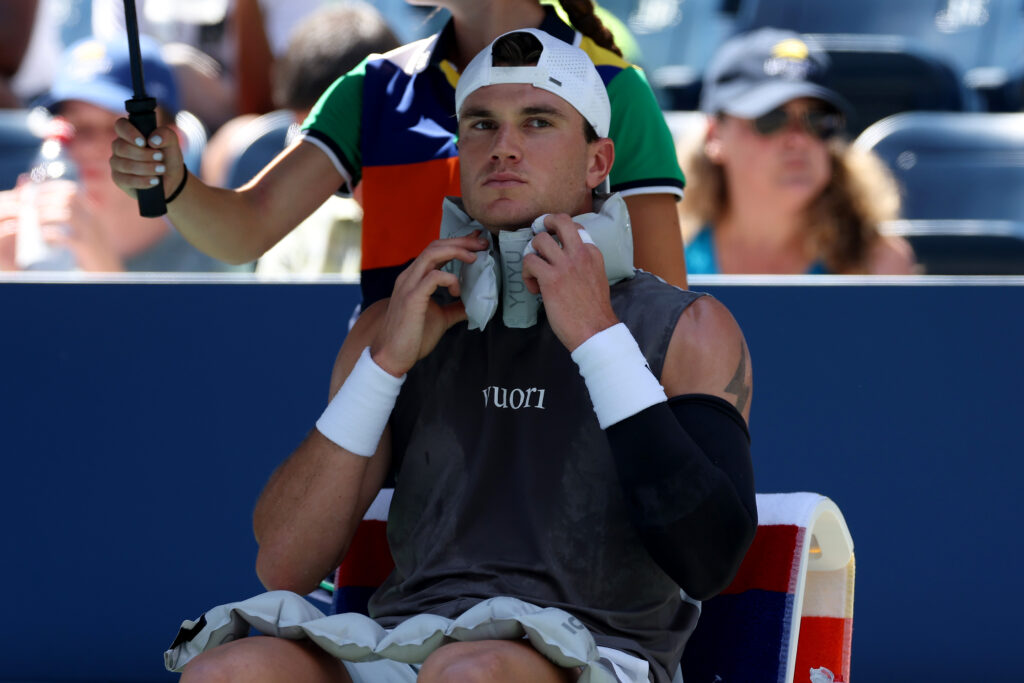 Jack Draper of the United Kingdom cools down during a stoppage in play against Federico Agustin Gomez of Argentina during their Men's Singles First Round match on Day Two of the 2025 US Open at USTA Billie Jean King National Tennis Center on August 25, 2025 in the Flushing neighborhood of the Queens borough of New York City.