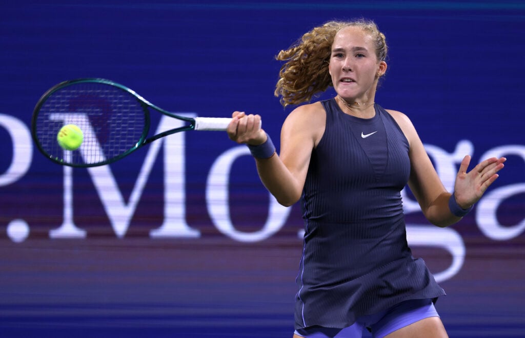 Mirra Andreeva returns a shot against Alycia Parks of the United States during their Women's Singles First Round match on Day Two of the 2025 US Open at USTA Billie Jean King National Tennis Center on August 25, 2025 in the Flushing neighborhood of the Queens borough of New York City.