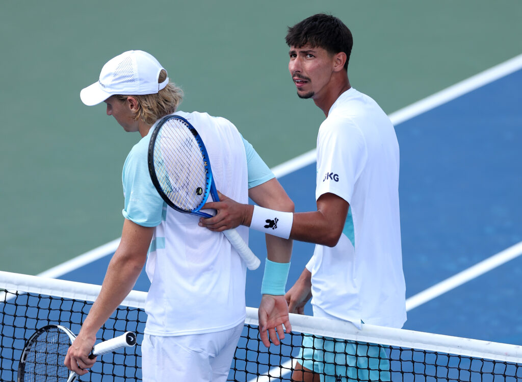 Alexei Popyrin of Australia consoles Emil Ruusuvuori of Finland after a win during their Men's Singles First Round match on Day Three of the 2025 US Open at USTA Billie Jean King National Tennis Center on August 26, 2025 in the Flushing neighborhood of the Queens borough of New York City.