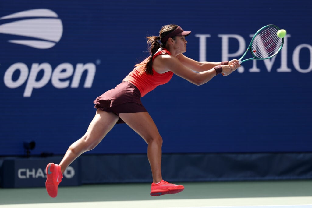 Emma Raducanu stretches for a backhand