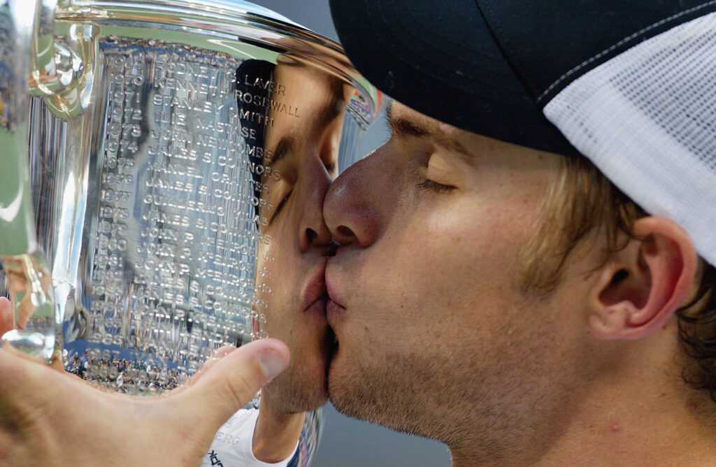 Andy Roddick kisses the winner's trophy after defeating Juan Carlos Ferrero of Spain during the US Open men's singles final at the USTA National Tennis Center in Flushing Meadows Corona Park on September 7, 2003 in Flushing, New York. Roddick defeated Ferrero 6/3, 7/6(2), 6/3.