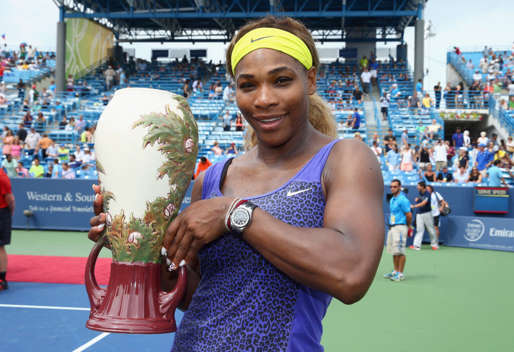 Serena Williams holds the winner's trophy after beating Ana Ivanovic of Serbia 6-4,6-1 during the finals of the Western & Southern Open on August 17, 2014 at the Linder Family Tennis Center in Cincinnati, Ohio