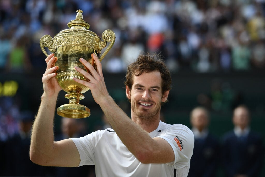 Britain's Andy Murray poses with the winner's trophy after his men's singles final victory over Canada's Milos Raonic on the last day of the 2016 Wimbledon Championships at The All England Lawn Tennis Club in Wimbledon, southwest London, on July 10, 2016.