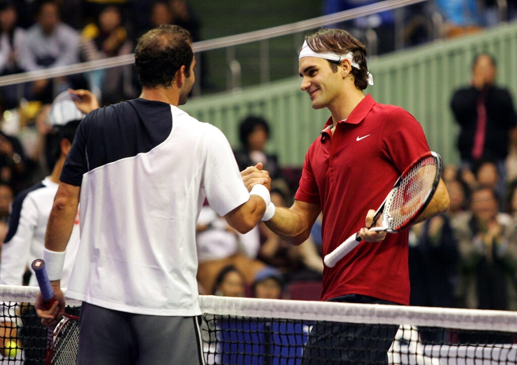 Pete Sampras and Roger Federer shake hands