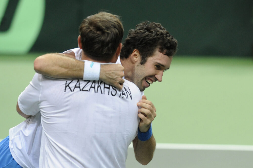 Mikhail Kukushkin of Kazakhstan (r) celebrates with his coach of Kazakhstan's national Davis Cup team Yegor Shaldunov after he won over Jan Hajek of the Czech Republic in the first round World group of Davis Cup match at the Ostrava's Cez Arena on March 6, 2011, in North Moravia. Kukushkin defeated Hajek 6-4,6-7,7-6,6-0.