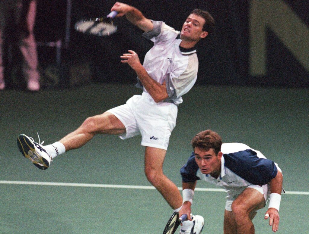 Zimbabwe's doubles team Byron (L) and Wayne Black (R) in action during their Davis Cup match against Chile's Nicolas Massu and Fernando Gonzalez in Harare 25 September 1999. Chile won 3 sets to 2 (3-6, 6-2, 4-6, 6-2, 6-4).