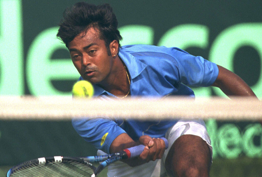 Indian tennis player Leander Paes returns a shot during the second singles match of the Davis Cup against Japanese player Takao Suzuki in New Delhi, 07 February 2003. Paes won 7-6, 7-4, 6-3.