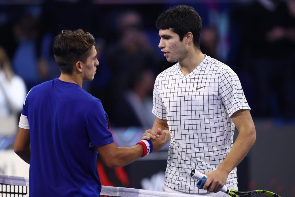 Carlos Alcaraz of Spain is congratulated after his victory over Sebastian Baez of Argentina in the semi finals during Day Four of the Next Gen ATP Finals at Palalido Stadium on November 12, 2021 in Milan, Italy.